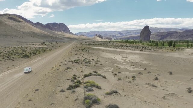 Sequence shot of a motorhome driving on a dirt road through the Patagonian steppe towards Piedra Parada in Chubut, Argentina