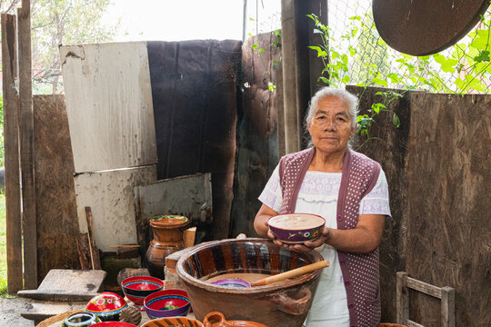 Woman showcasing traditional cacao beverage