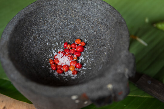 Close-up of red chilli and salt in mortar for traditional meals