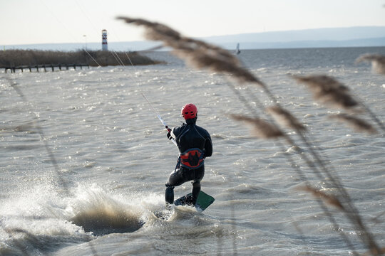 Kitesurfer Riding Away Across Open Water