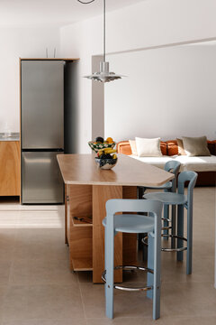 Modern apartment dining area presenting a neat, uncluttered interior
