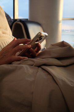 Close-Up of Phone Use While Waiting