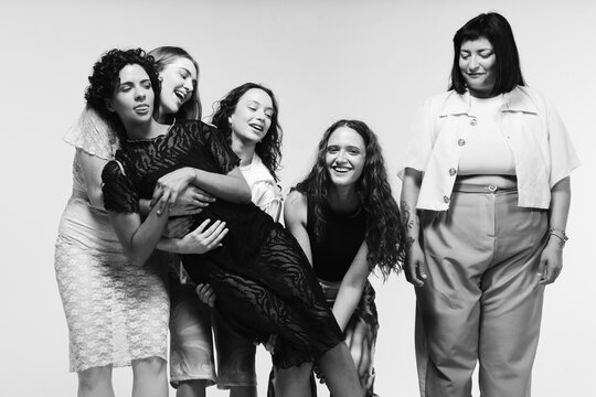 Modern womenswear editorial featuring five women