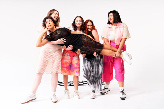 Five women celebrating friendship through fashion