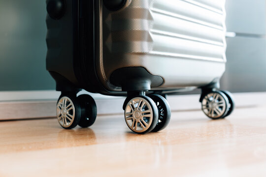 Travel suitcase with wheels ready for a trip in an indoor space