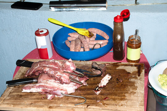 Grilling Meat and Preparing Sausages for Cooking Outdoors
