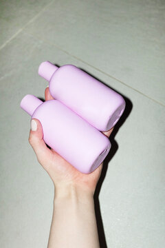 Pastel baby pink plastic mockup bottles with space for text or design