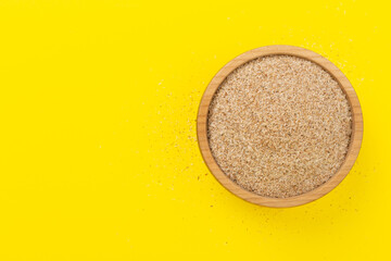 Psyllium husk powder with fresh leaves on color background, top view © Liami