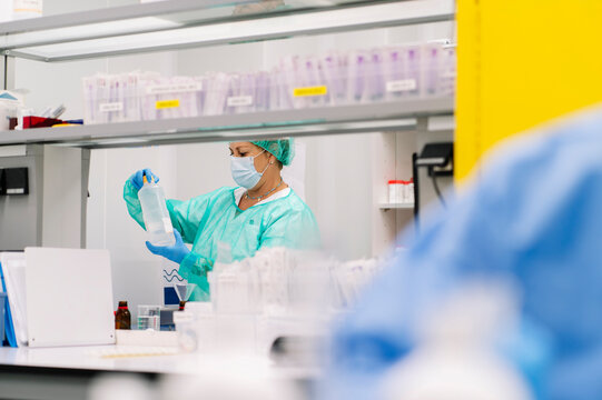 Pharmacy professional preparing medication in hospital laboratory