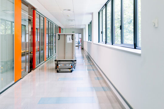 Hospital robot delivering supplies in modern corridor
