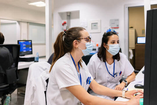 Medical staff collaborating in hospital pharmacy department