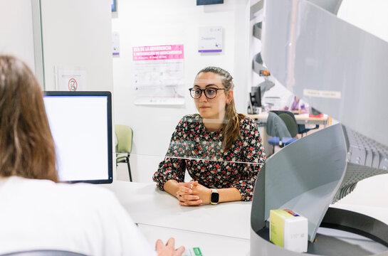 Patient consulting pharmacist in hospital pharmacy department