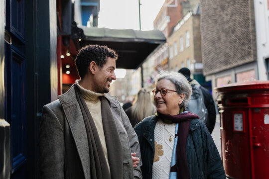 Mother and adult son enjoying London city street
