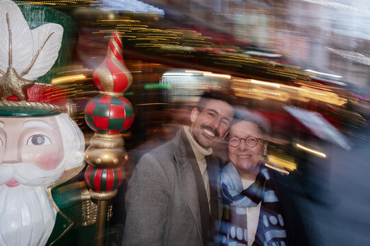 Son and mother with nutcracker celebrating Christmas holidays