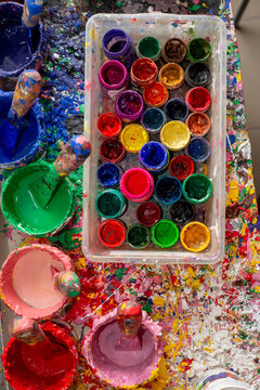 Lots of cans of colored paints for drawing