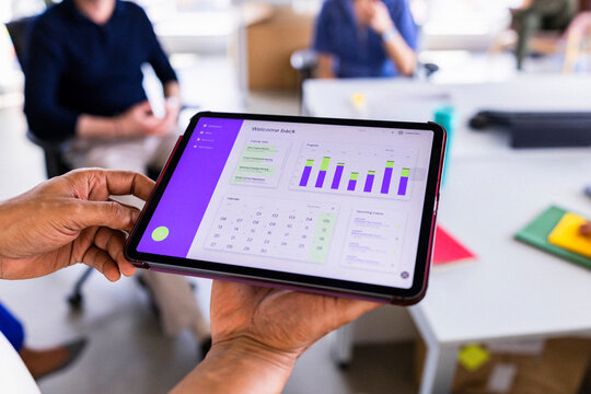 Tablet With Dashboard Screen In Modern Office Workspace