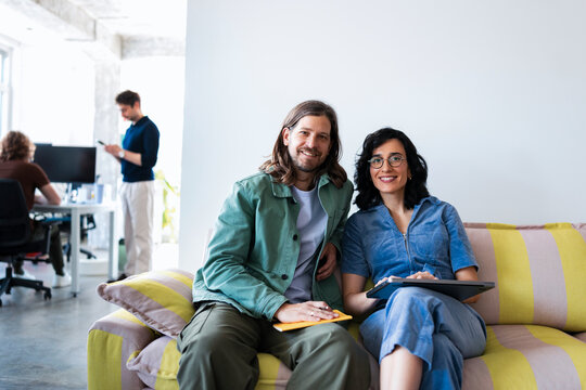 Business People Sitting On Colorful Couch