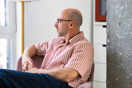 Relaxed Man Seated Indoors 