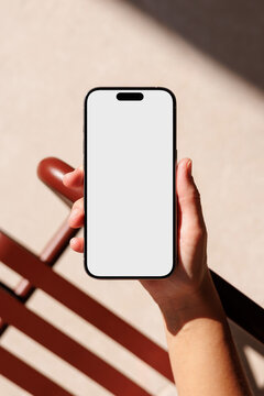 Phone mockup with white screen in sunlight