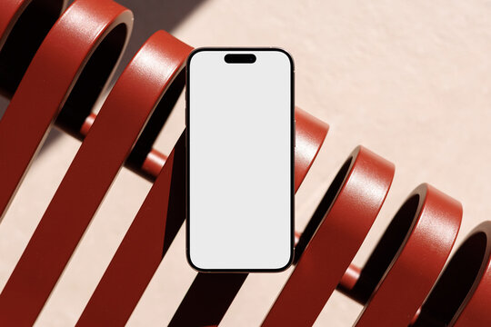 Phone mockup with white screen on red bench