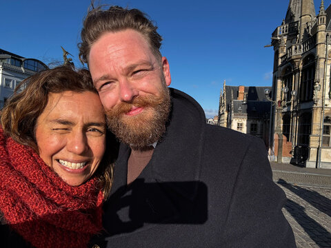 Couple Takes Selfie in Ghent City Square During Sunny Day