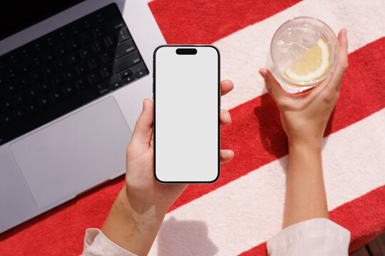 Phone mockup with white screen on red towel 