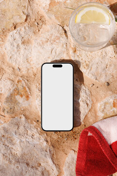 Smartphone Mockup on Stone Surface with Drink and Towel