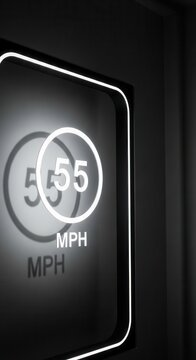 Illuminated Speedometer Displaying Fifty-Five Miles Per Hour In A Modern Vehicle Setting