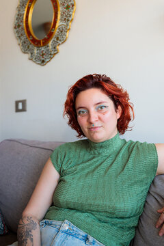 Relaxed Portrait of Woman Sitting on Couch