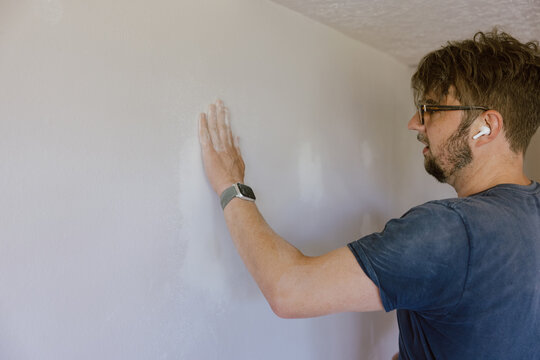 Inspecting Drywall Surface by Hand