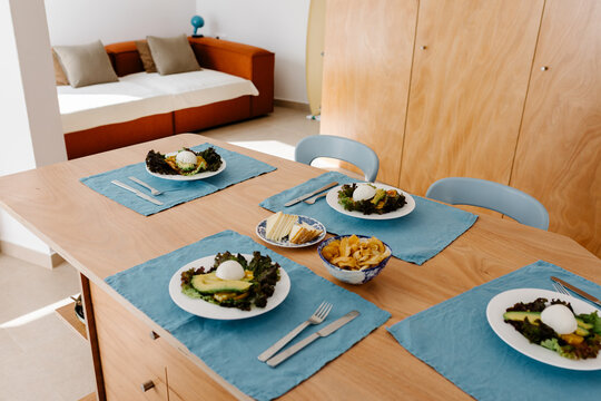 Apartment dining room with the table set for four people