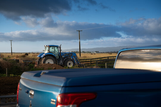 Blue Ute Frames Blue Tractor at Sunrise