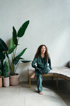 Relaxing Moment in a Serene Indoor Space With Lush Plants