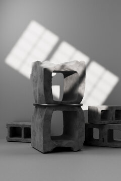 3D render of balanced concrete blocks on flat surface