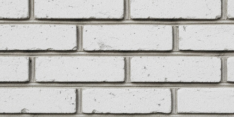 Fototapeta premium Close up view of a white brick wall texture with subtle shadows and grout lines