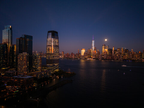 New York City Skyline at Night With Lights Reflecting on the Water