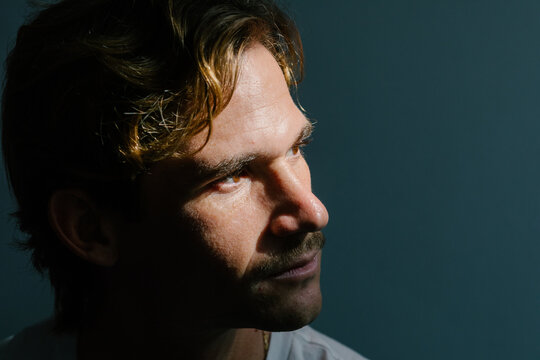 Conceptual close-up portrait of a man with serious and determined gaze
