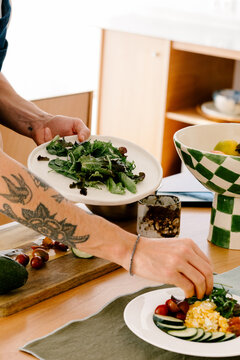 Anonymous man serving a healthy breakfast dish