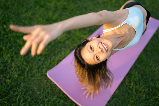 Yoga practice in green park space

