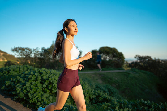 Running during sunset on a trail
