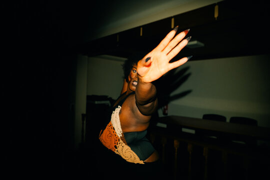 Dance Performance in a Dimly Lit Space at Night