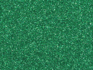 Macro photography of vibrant emerald green metallic paint texture with fine sparkles