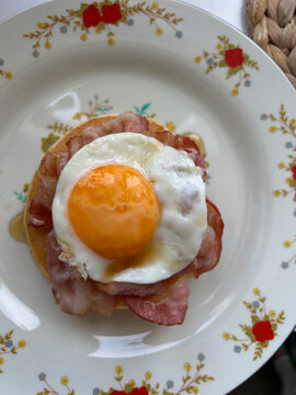 Pancake stack with bacon and fried egg breakfast