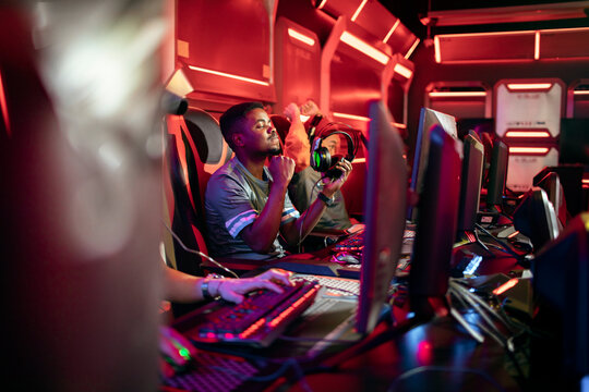 Esports team celebrating victory in gaming arena