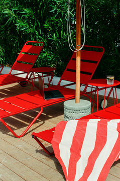 Summer Poolside Relaxation With Red Chairs Film Photo