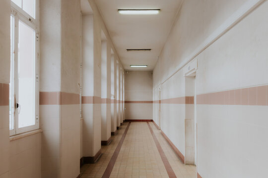 Empty hallway with vintage tiles and bright lighting