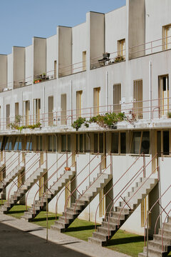 Modern apartment building facade with staircases
