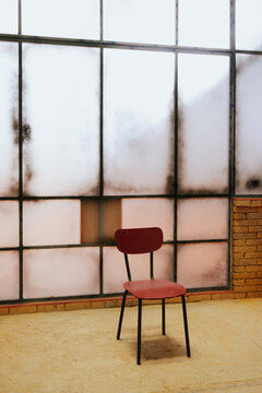 Vintage chair in a sunlit industrial loft space