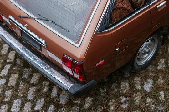Close-up of a vintage car with raindrops