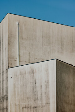 Minimalist architectural corner with clear blue sky